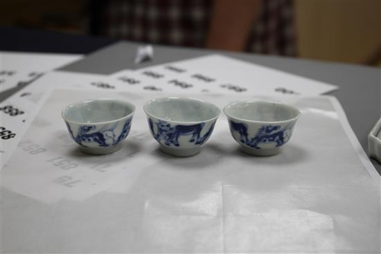 Six 19th century Chinese blue and white horses tea bowls and a later blue and white tray, length 16cm